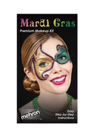 Mardi Gras Premium Makeup Kit by Mehron, featuring a model with elegant masquerade face makeup in green, gold, and purple on a black background.