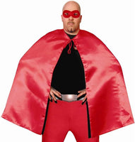 A man wearing a red superhero cape costume with a matching red mask, red pants, and a black top against a plain white background.