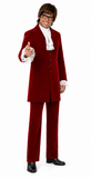 A man modeling a red velvet two-piece suit with a white ruffled shirt, white cravat, and black dress shoes against a plain white background.