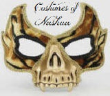 A skull-shaped masquerade mask with a gold and black pattern, featuring cutout eye holes. The image has a watermark at the top reading 'Cashiers of Nashua'.