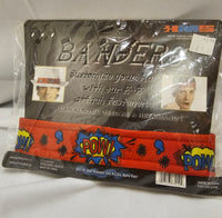 A packaged costume accessory set labeled 'BANDS' by HM'S, containing a red elastic headband with comic-style 'POW!' graphics and a black headband with a white hat band, shown in clear plastic packaging on a white fabric background.