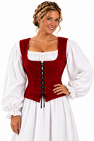A woman wearing a medieval-style costume dress with a deep red lace-up corset vest over a white long-sleeve blouse and white skirt, photographed against a plain white background.
