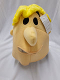 A yellow and beige plush character head with black eyes, a large beige nose, and bright yellow hair, shown with a white product tag against a white fabric backdrop.