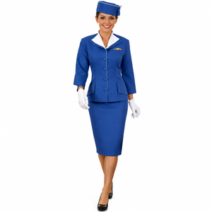 A woman in a vintage Pan Am stewardess costume, consisting of a blue jacket, skirt, and hat.
