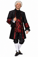 A man modeling a historical or period costume consisting of a black doublet jacket with red patterned trim, black breeches, white stockings, white gloves, and a white powdered wig, photographed against a plain white background.