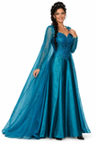 A costume dress featuring a blue satin gown with a jeweled bodice and a silver-printed cape, designed to resemble an ice queen or princess.