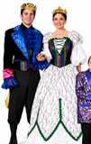 A man and a woman wearing elaborate royal or fairy-tale costumes stand against a plain white background. The man wears a black costume with bright blue ruffled trim, multicolored sequined accents, pink cuffs, and a gold crown.