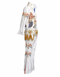 A white Elvis Presley-style jumpsuit costume shown in side profile on a white background, heavily embellished with gold chains, red and blue rhinestones, and gold star details.