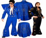 Elvis-style costume set shown on a white background, including a blue jumpsuit with gold starburst embroidery, a matching blue cape, a blue draped table cover, and a black matching jumpsuit with gold embroidery. Two male models are present, one wearing the blue outfit and one wearing the black outfit.