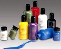 An array of Mehron Professional Liquid Makeup bottles in various colors, including blue, green, purple, black, red, pink, orange, white, and yellow, with a visible blue liquid makeup swatch.